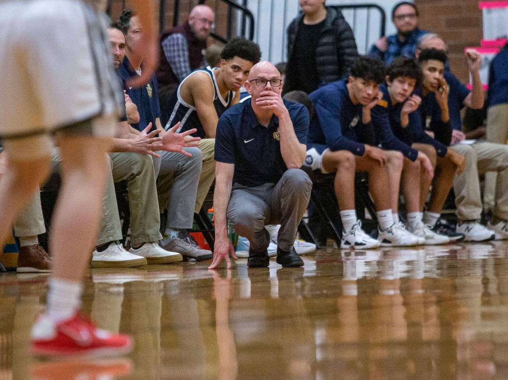 Everett head coach Bobby Thompson watches his players as they set up for a play during the game against Mountlake Terrace on Tuesday, Jan. 17, 2023 in Mountlake Terrace, Washington. (Olivia Vanni / The Herald)