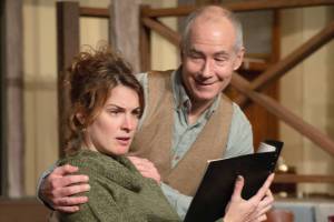 Sidney_Myra_manuscript: Sidney Bruhl (Jag) encourages his wife Myra (Mary Leedy) to read a student’s play manuscript in Ira Levin’s “Deathtrap,” running Jan. 20 through Feb. 5 at the Red Curtain Arts Center, 9315 State Ave. #J in Marysville.  "Jag" is cq.