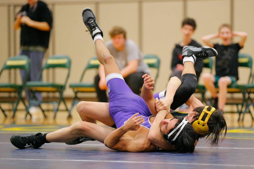 Shorecrests George Fernandez gets Edmonds-Woodways Aiden Kim in a hold on Wednesday, Jan. 18, 2023, at Shorecrest High School in Shoreline, Washington. (Ryan Berry / The Herald)