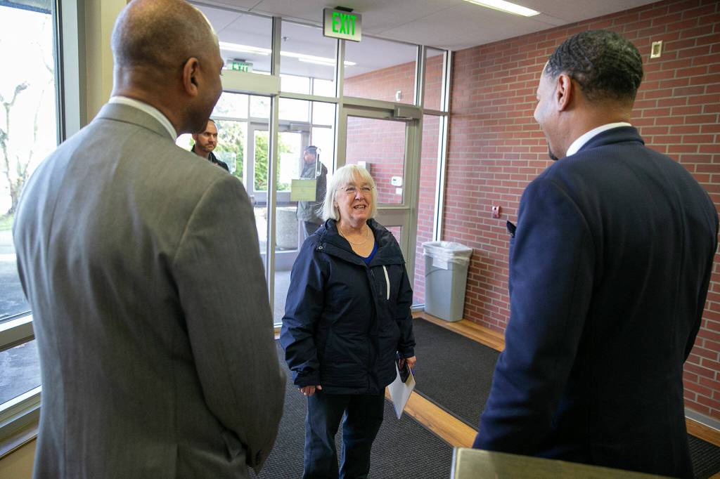 Senator Patty Murray is greeted by Dr. Paul Pitre, Chancellor of WSU Everett, left, and Dr. Darrell Cain, Interim President of ECC, prior to a roundtable meeting to discuss access to higher education and Pell Grant increases Thursday, Jan. 19, 2023, at Everett Community College in Everett, Washington. (Ryan Berry / The Herald)