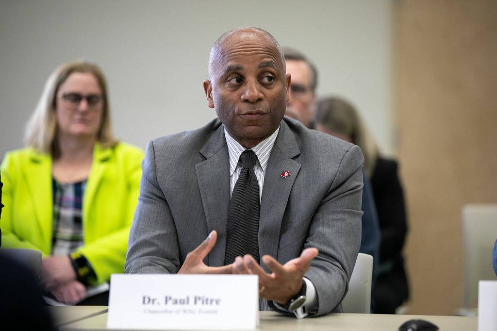 Dr. Paul Pitre, Chancellor of WSU Everett, briefly speaks with Senator Patty Murray during a roundtable meeting to discuss access to higher education and Pell Grant increases Thursday, Jan. 19, 2023, at Everett Community College in Everett, Washington. (Ryan Berry / The Herald)