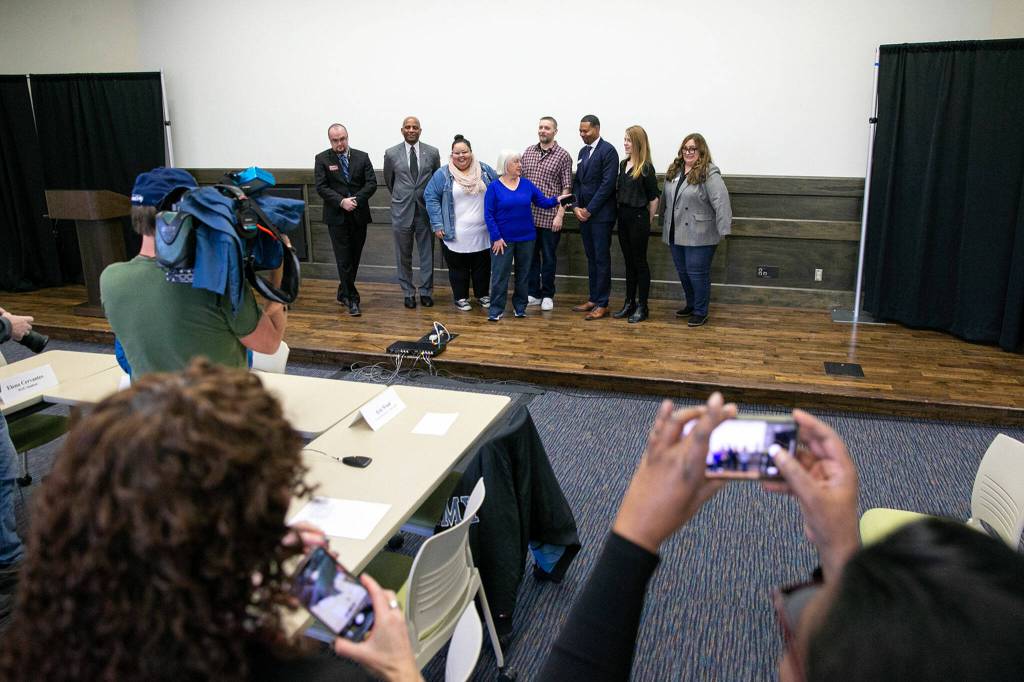 Senator Patty Murray takes photos with the participants of a roundtable meeting to discuss access to higher education and Pell Grant increases Thursday, Jan. 19, 2023, at Everett Community College in Everett, Washington. (Ryan Berry / The Herald)