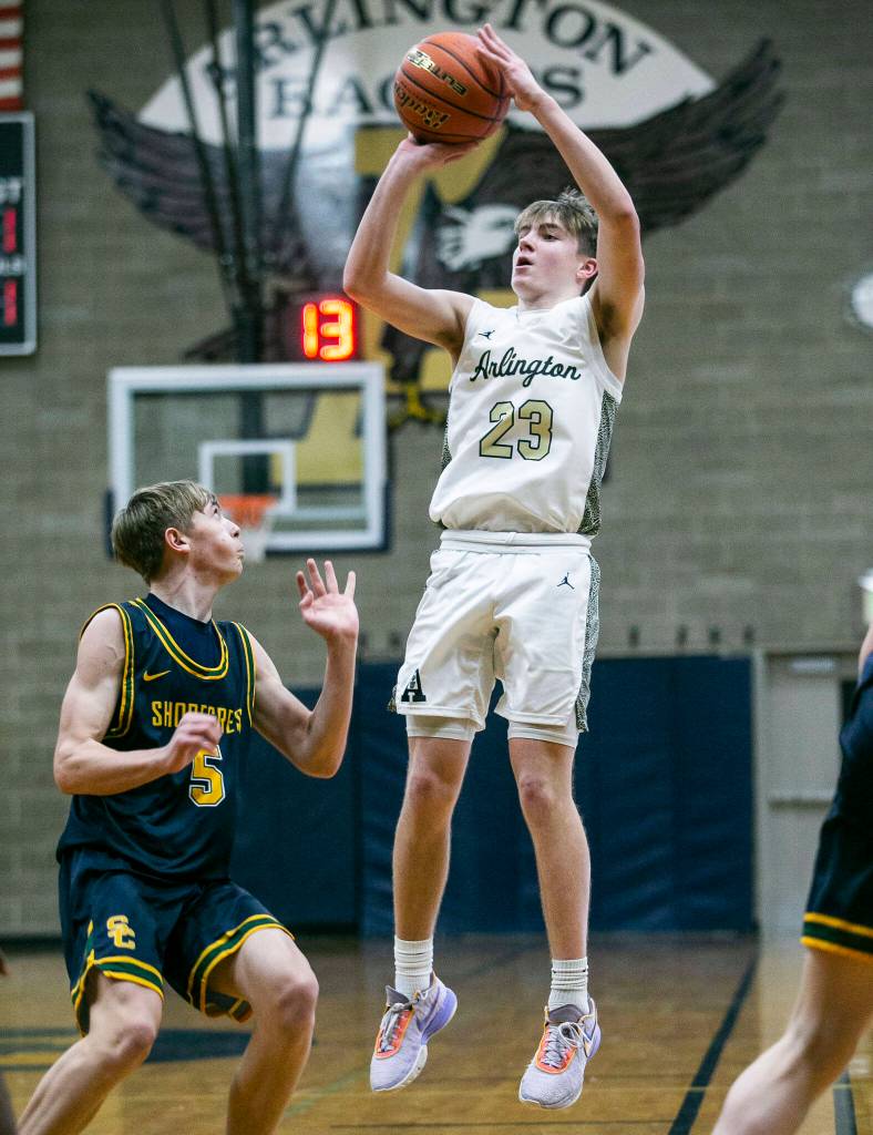Arlingtons Leyton Martin attempts a three-point shot during the game against Shorecrest on Thursday, Jan. 19, 2023 in Arlington, Washington. (Olivia Vanni / The Herald)