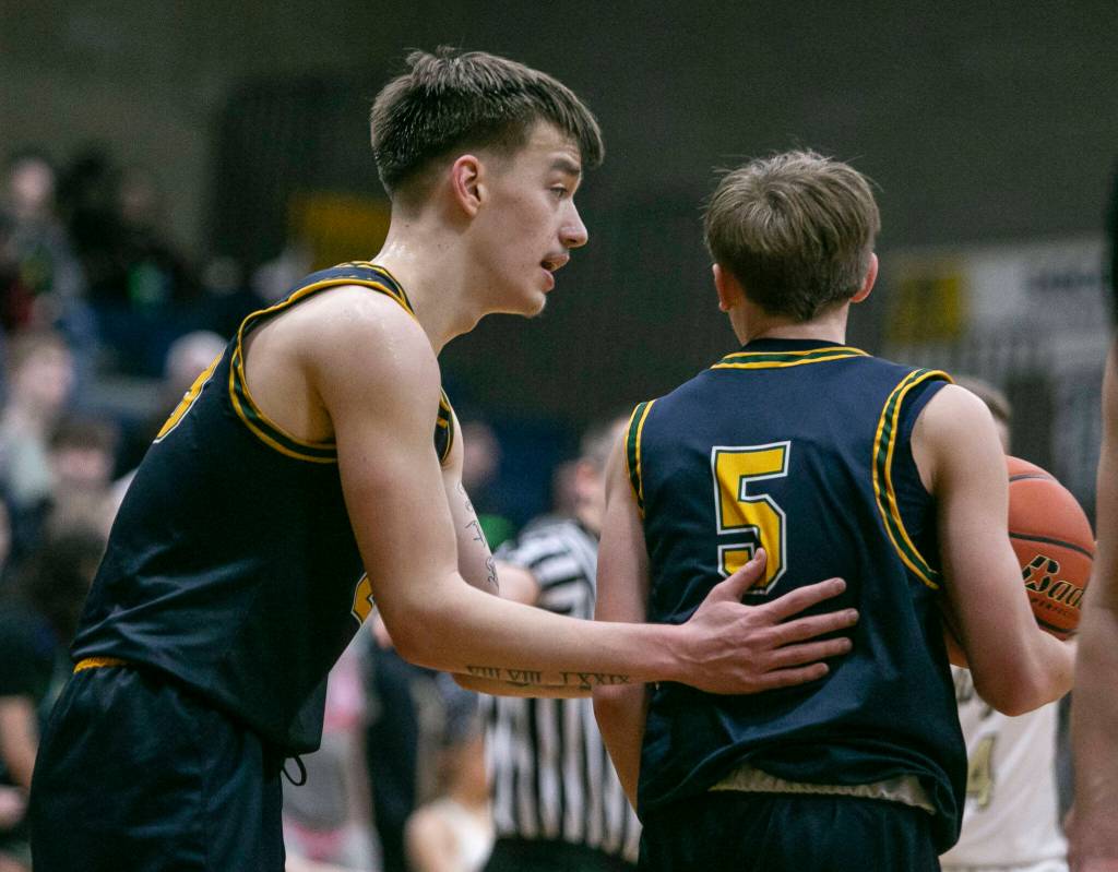 Shorecrests Parker Baumann talks to his teammate Brayden Fischer during the game against Arlington on Thursday, Jan. 19, 2023 in Arlington, Washington. (Olivia Vanni / The Herald)