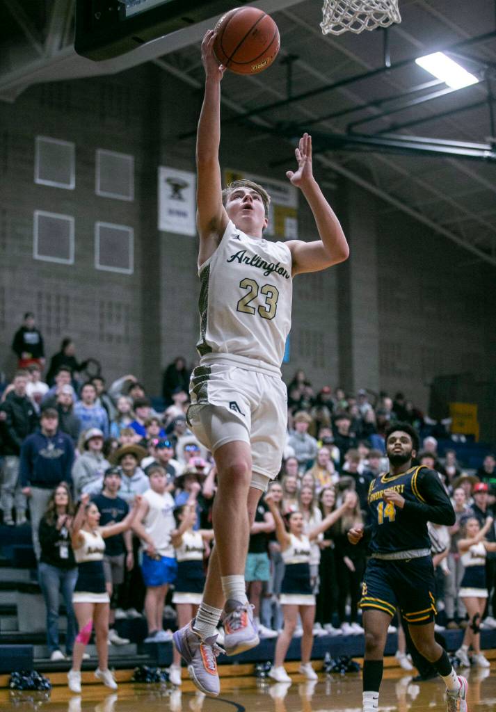 Arlingtons Leyton Martin makes a layup during the game against Shorecrest on Thursday, Jan. 19, 2023 in Arlington, Washington. (Olivia Vanni / The Herald)