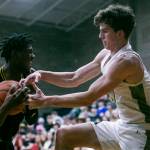 Arlingtons David Zachman tries to grab the ball from Shorecrests Disma Kagarabi during the game on Thursday, Jan. 19, 2023 in Arlington, Washington. (Olivia Vanni / The Herald)