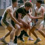 Shorecrests Evan Solomon scrambles for the ball with other Arlington players during the game on Thursday, Jan. 19, 2023 in Arlington, Washington. (Olivia Vanni / The Herald)