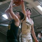 Arlingtons David Zachman blocks a shot by Shorecrests Parker Baumann during the game on Thursday, Jan. 19, 2023 in Arlington, Washington. (Olivia Vanni / The Herald)