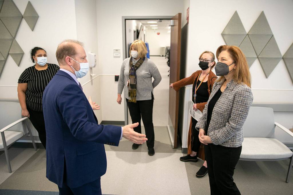 Rep. Kim Schrier, right, speaks with Thomas Bundt, Executive Director of the VA Puget Sound Health Care System, during a visit to the VA systems new Everett Clinic on Friday, Jan. 20, 2023, in Everett, Washington. (Ryan Berry / The Herald)