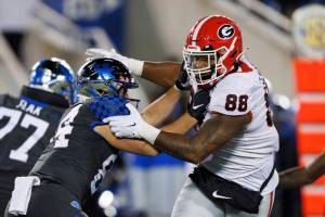 FILE -Kentucky tight end Josh Kattus (84) blocks Georgia defensive lineman Jalen Carter (88) during the second half of an NCAA college football game in Lexington, Ky., Saturday, Nov. 19, 2022. Jalen Carter was selected to The Associated Press All-America team released Monday, Dec. 12, 2022. (AP Photo/Michael Clubb, File)