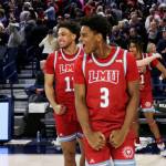 Loyola Marymount guards Chance Stephens (right) and Kwane Marble celebrate the teams 68-67 win over Gonzaga on Thursday in Spokane. (AP Photo/Young Kwak)