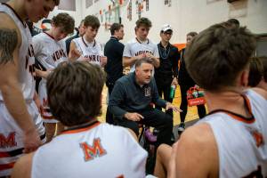 Head coach Justin Prohn, gives feedback during a game between the Monroe Bearcats and the Edmonds-Woodway Warriors at Monroe High School in Monroe, Washington on Friday, Jan. 20, 2023. The Bearcats defeated the Warriors, 68-57. (Annie Barker / The Herald)