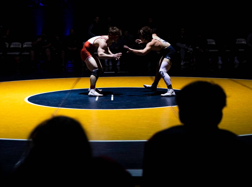 Arlingtons Dustin Baxter and Stanwoods Ryder Bumgarner wrestle during the 170 pound weight class match on Tuesday, Jan. 24, 2023 in Arlington, Washington. (Olivia Vanni / The Herald)