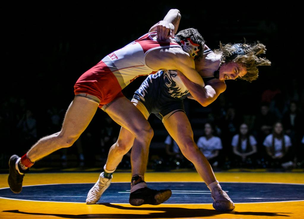 Arlingtons Beau Gudde tries to throw Stanwoods Bryan Roodzant during the 126 pound weight class match on Tuesday, Jan. 24, 2023 in Arlington, Washington. (Olivia Vanni / The Herald)