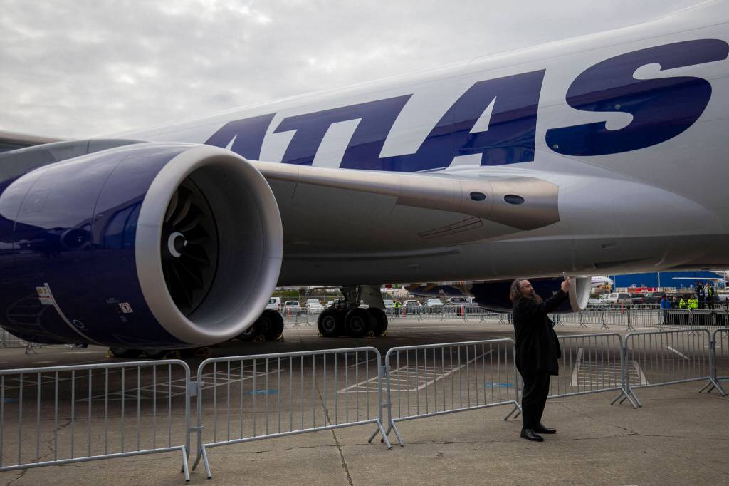 People take selfies with the final 747 airplane on Tuesday, in Everett. (Annie Barker / The Herald)