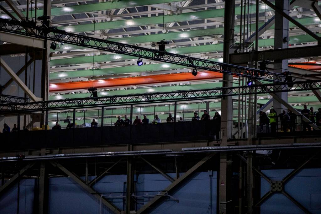 Workers listen and watch during a 747 celebration on Tuesday, in Everett. (Annie Barker / The Herald)