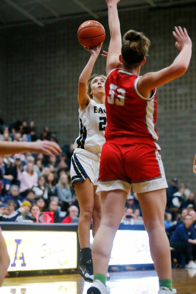 Arlingtons Samara Morrow tries a short jumper against Stanwood on Wednesday, Jan. 25, 2023, at Arlington High School in Arlington, Washington. (Ryan Berry / The Herald)