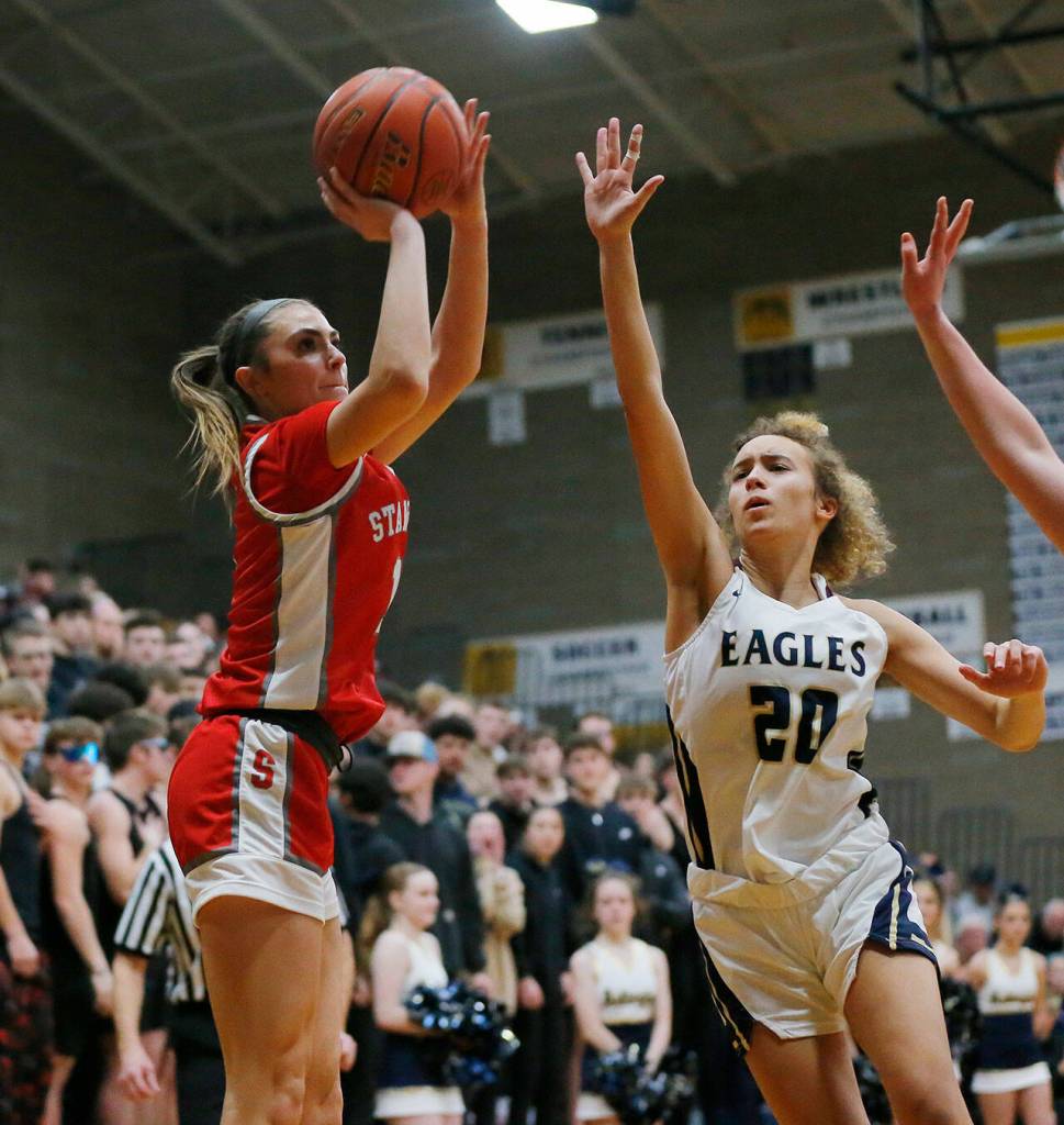 Stanwoods Tatum Brager shoots from the corner against Arlington on Wednesday, Jan. 25, 2023, at Arlington High School in Arlington, Washington. (Ryan Berry / The Herald)