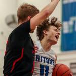 ECs Caleb Lee (11) fights to keep the ball during a mens game between the Everett Community College Trojans and Edmonds College Tritons at Seaview Gymnasium at Edmonds College in Lynnwood, Washington on Wednesday Jan. 25, 2023. The Tritons won, 91-84. (Annie Barker / The Herald)