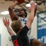 ECs Chris Lee (10) shoots the ball during a mens game between the Everett Community College Trojans and Edmonds College Tritons at Seaview Gymnasium at Edmonds College in Lynnwood, Washington on Wednesday Jan. 25, 2023. The Tritons won, 91-84. (Annie Barker / The Herald)