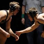 Lake Stevens Brandon Resor and Glacier Peaks Gil Mossburg wrestle at Lake Stevens High School on Thursday Jan. 26, 2023. (Annie Barker / The Herald)