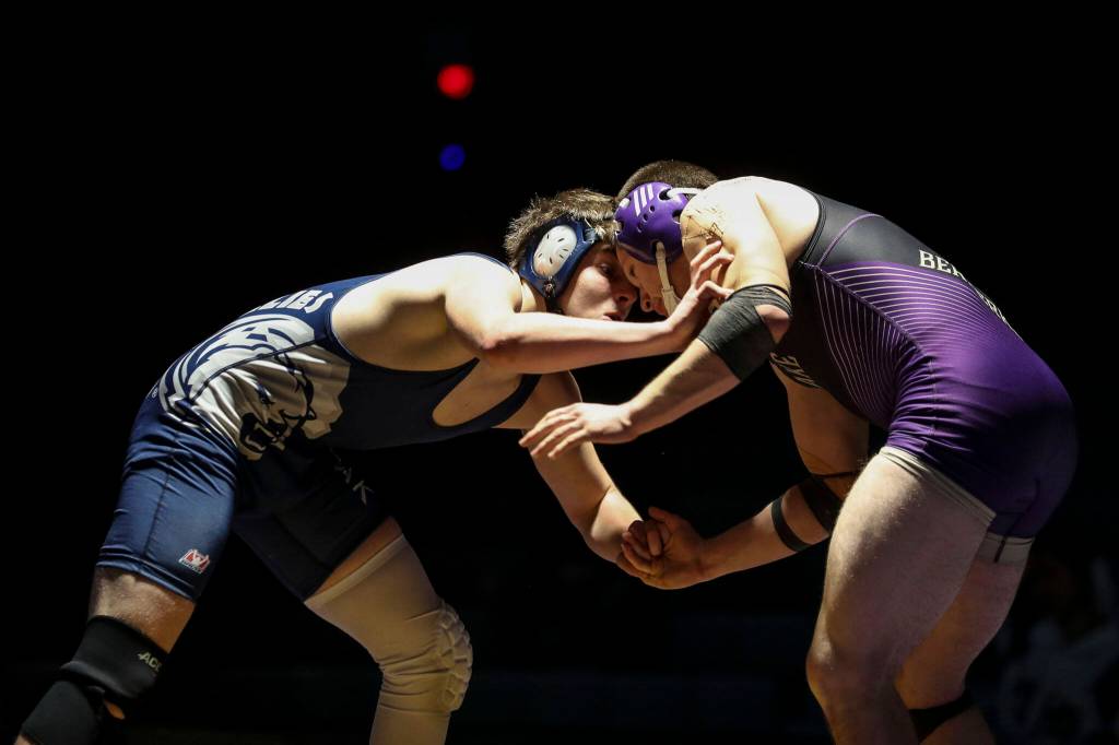 Lake Stevens Esteban Sedano Jr. and Glacier Peaks John Allison wrestle at Lake Stevens High School on Thursday Jan. 26, 2023. (Annie Barker / The Herald)