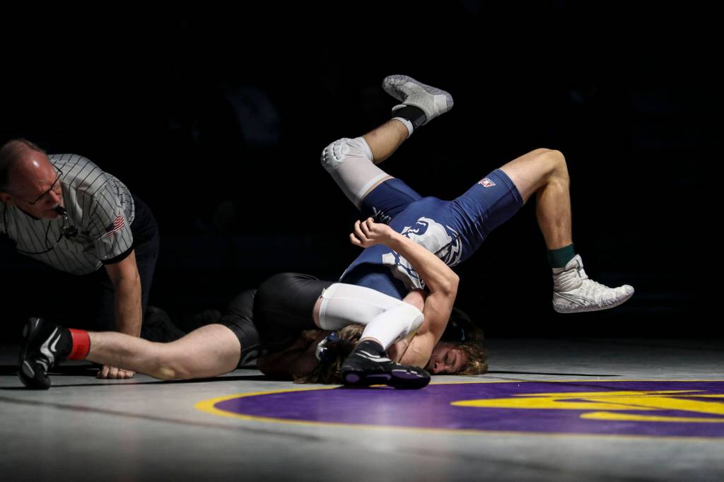Lake Stevens Troy Valentine and Glacier Peaks London Owens wrestle at Lake Stevens High School on Thursday Jan. 26, 2023. (Annie Barker / The Herald)