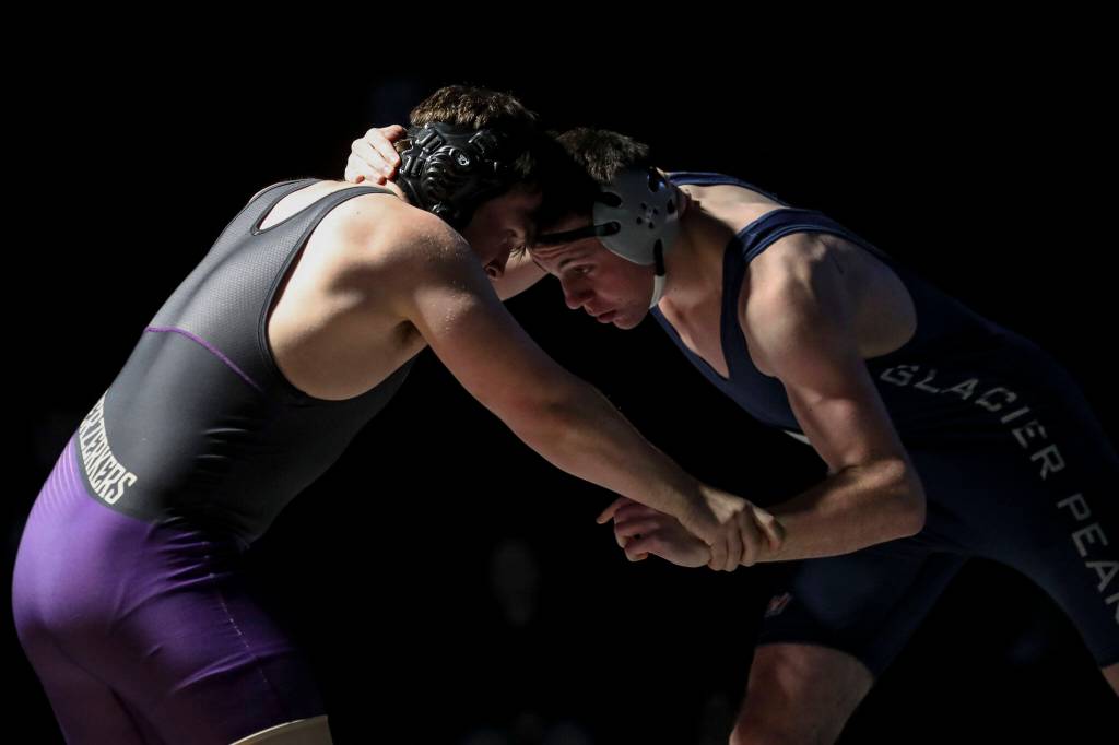 Lake Stevens Lucas Overland and Glacier Peaks Angus van Valey wrestle during the 195 pound weight class match at Lake Stevens High School on Thursday Jan. 26, 2023. (Annie Barker / The Herald)