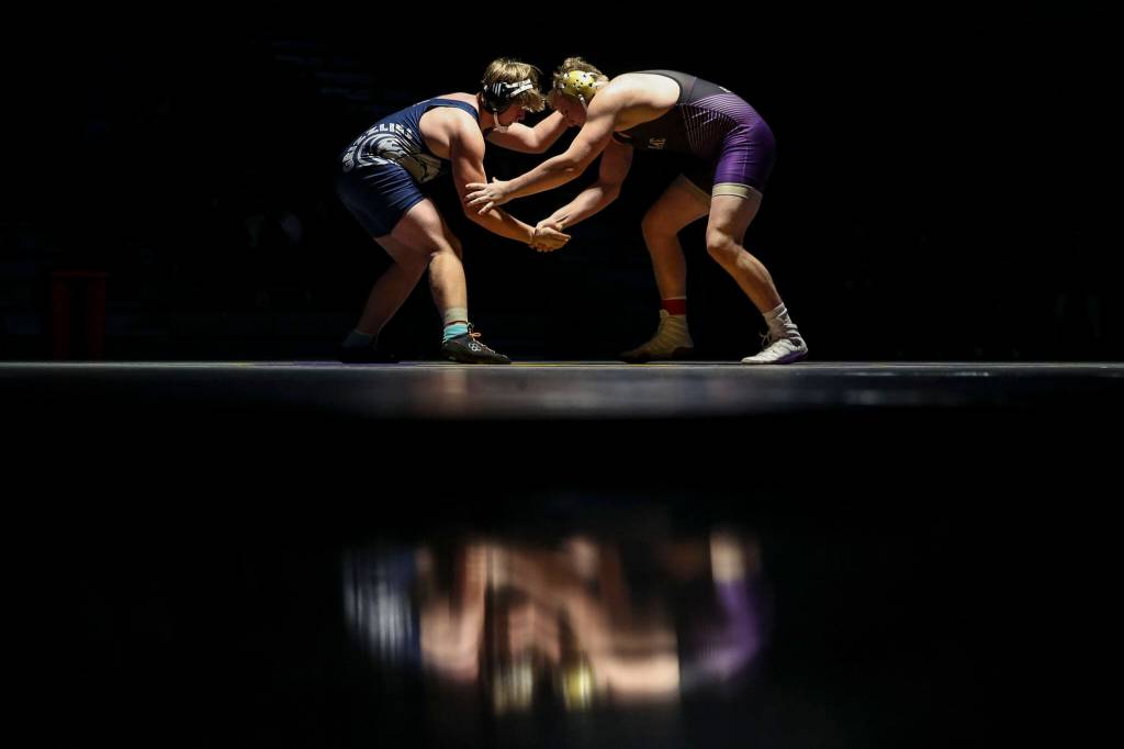 Lake Stevens Koen Mattern and Glacier Peaks Dane Chapman wrestle during the 220 pound weight class match at Lake Stevens High School on Thursday Jan. 26, 2023. (Annie Barker / The Herald)