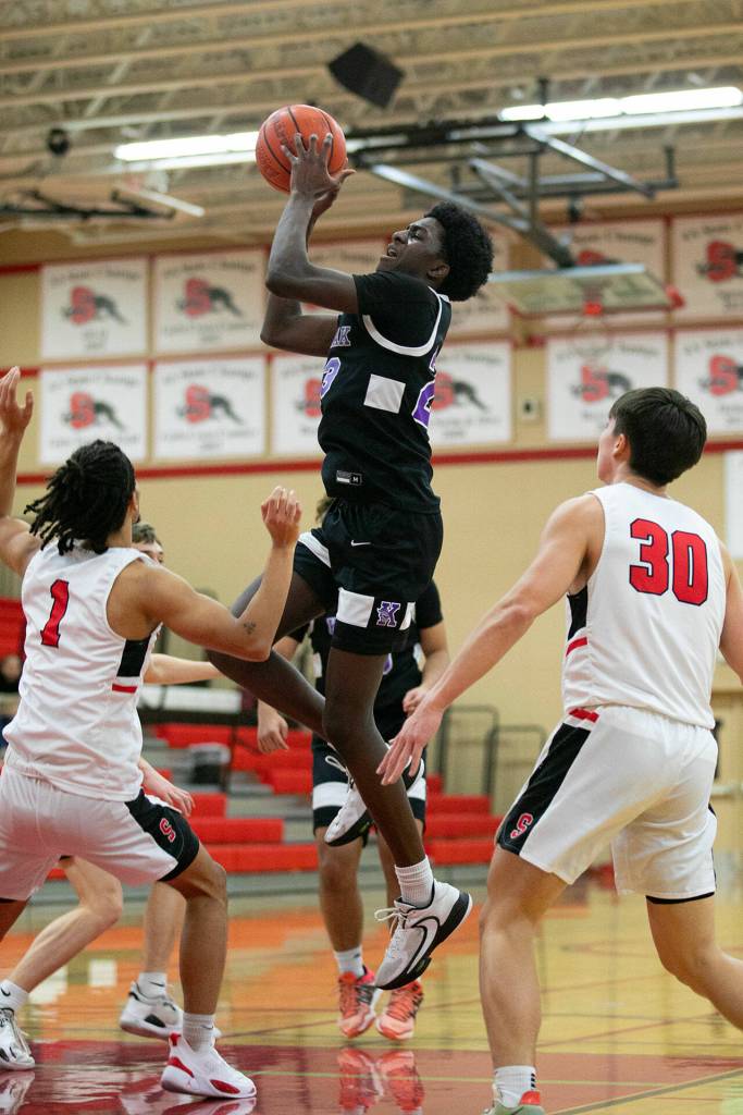 Kamiak senior Josiah Pierre elevates from midrange for a jumper during a matchup against Snohomish on Saturday, Jan. 28, 2023, in Snohomish, Washington. (Ryan Berry / The Herald)