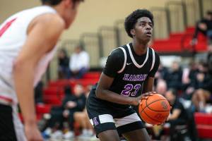 Kamiak senior forward Josiah Pierre shoots and sinks a pair of free throws during a matchup against Snohomish on Saturday, Jan. 28, 2023, in Snohomish, Washington. (Ryan Berry / The Herald)
