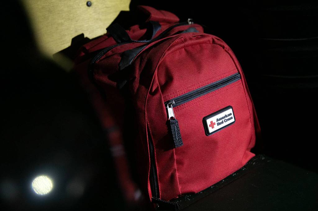 A Red Cross backpack is among the many emergency kits stocked by Ron and Gail Thompson. (Ryan Berry / The Herald)