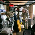 Ron Thompson looks around inside a trailer that he and his wife Gail keep stocked with emergency supplies in case of emergency at their home Thursday, Feb. 2, 2023, in Oso, Washington. The Thompsons lost their home to the 2014 slide that claimed dozens of lives, and in the years since, they have worked to prepare themselves and their community members for future disaster. (Ryan Berry / The Herald)