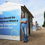 CEO Amy King standing outside of a pallet shelter. (Courtesy of Pallet Shelter)