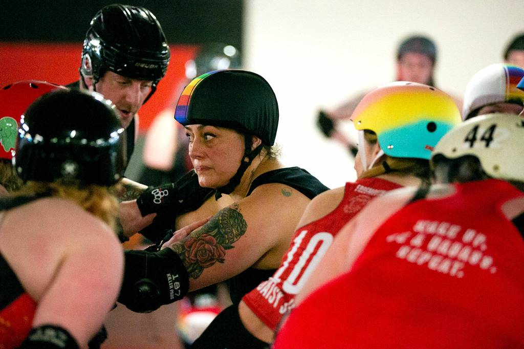 Star Ta Riot Carly Hay, working as a pivot for the black team, prepares for a jam during a Strawberry City Roller Derby practice at Marysville Skate Center on Monday, Feb. 6, 2023, in Marysville, Washington. (Ryan Berry / The Herald)