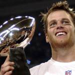 FILE - In this Feb. 1, 2004, file photo, New England Patriots quarterback Tom Brady holds the Vince Lombardi Trophy after the Patriots beat the Carolina Panthers 32-29 in Super Bowl 38 in Houston. Brady, who won a record seven Super Bowls for New England and Tampa, has announced his retirement, Wednesday, Feb. 1, 2023.  (AP Photo/Dave Martin, File)