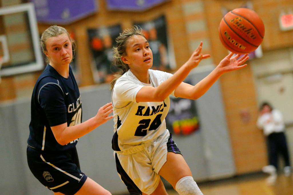 Kamiaks Bella Hasan passes to a teammate against Glacier Peak on Wednesday, Feb 1, 2023, at Kamiak High School in Mukilteo, Washington. (Ryan Berry / The Herald)