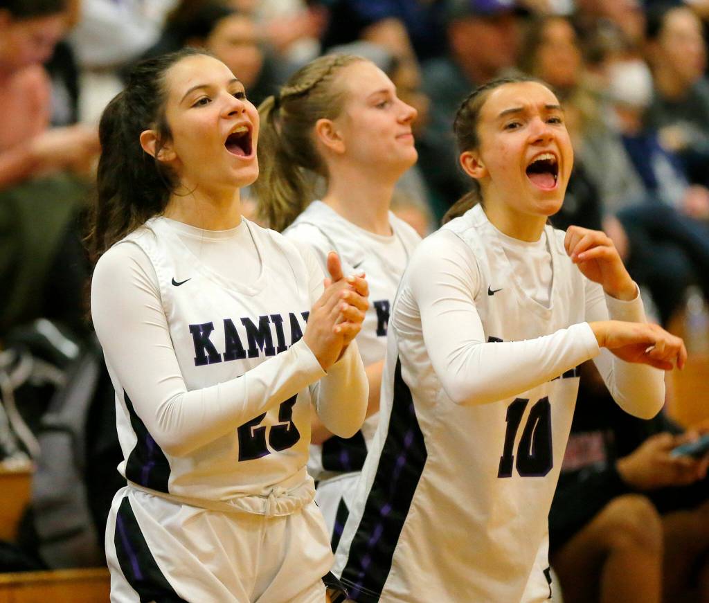 The Kamiak bench cheers their team after a score against Glacier Peak on Wednesday, Feb 1, 2023, at Kamiak High School in Mukilteo, Washington. (Ryan Berry / The Herald)