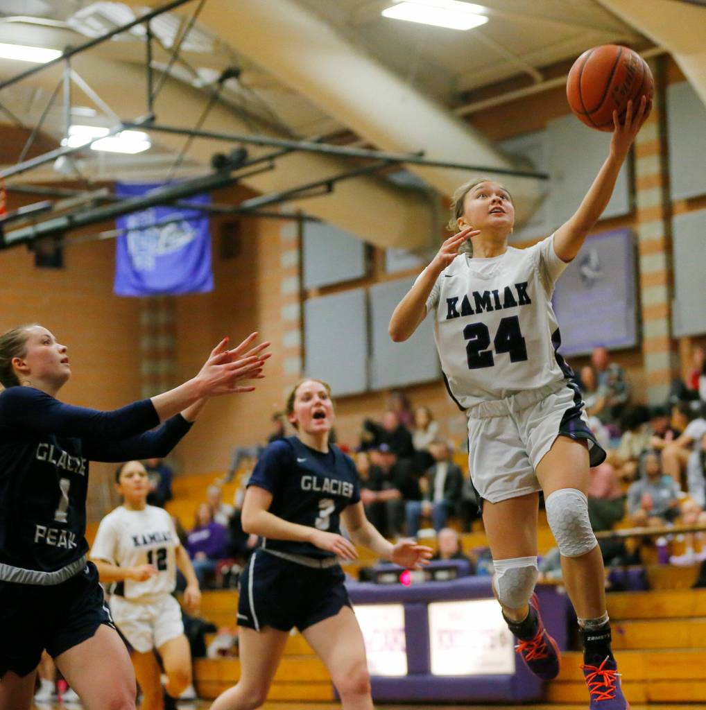 Kamiaks Bella Hasan finishes a fast break layup against Glacier Peak on Wednesday, Feb 1, 2023, at Kamiak High School in Mukilteo, Washington. (Ryan Berry / The Herald)