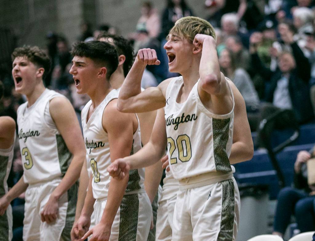 Arlingtons Kaid Hunter reacts to a teammates dunk during a game against Shorecrest on Jan. 19 at Arlington High School. (Olivia Vanni / The Herald)