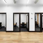 Coworking spaces include private offices, conference rooms and podcasts studios, all outfitted with high-tech amenities.