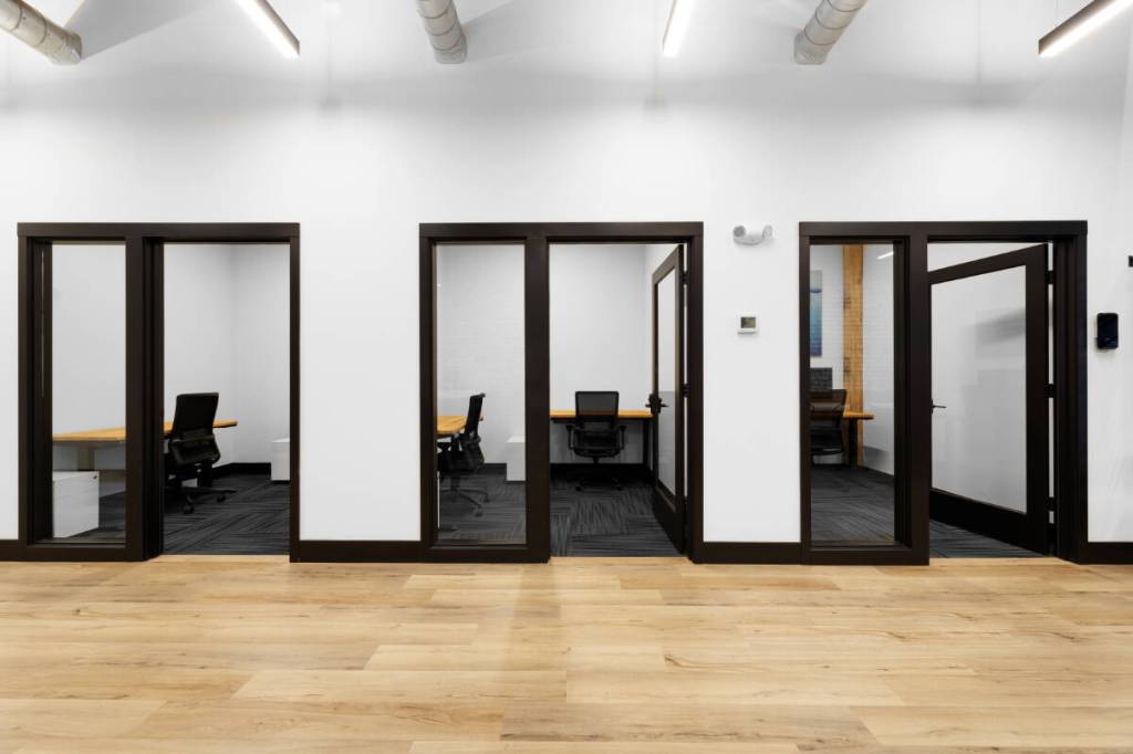 Coworking spaces include private offices, conference rooms and podcasts studios, all outfitted with high-tech amenities.