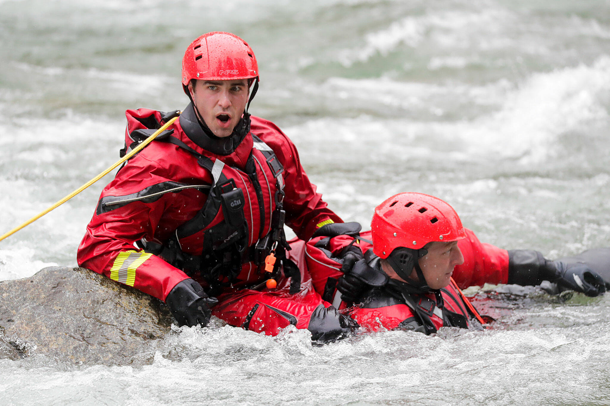 A firefighter called to the shore during the Snohomish Regional Fire & Rescues annual Water Rescue Academy on the Skykomish River on May 5, 2022, in Index. (Kevin Clark / The Herald)