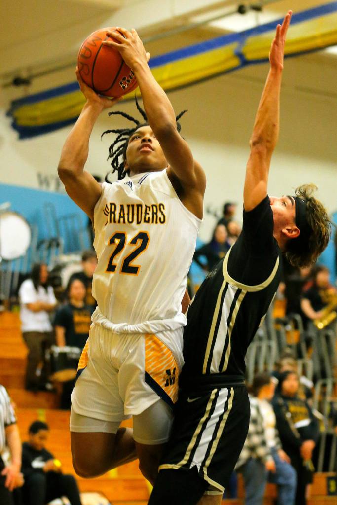 Mariners Stavontai McSwain puts up a shot while getting fouled against Lake Stevens on Thursday, Feb. 2, 2023, at Mariner High School in Everett, Washington. (Ryan Berry / The Herald)