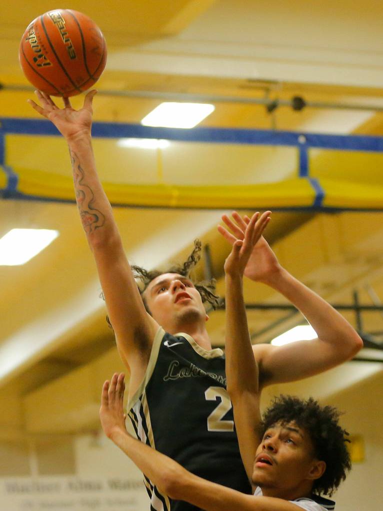 Lake Stevens Tyson Eyman tries a shot from close range against Mariner on Thursday, Feb. 2, 2023, at Mariner High School in Everett, Washington. (Ryan Berry / The Herald)