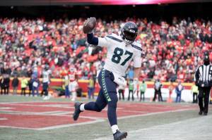 Seattle Seahawks tight end Noah Fant celebrates after catching a touchdown pass during the second half of an NFL football game against the Kansas City Chiefs Saturday, Dec. 24, 2022, in Kansas City, Mo. The Chiefs won 24-10. (AP Photo/Ed Zurga)