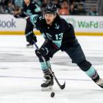Seattle Kraken forward Brandon Tanev skates with the puck during a game against the New York Islanders on Jan. 1 in Seattle. (AP Photo/Stephen Brashear)