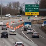 Orange traffic barrels direct drivers away from a section of I-5 that recently buckled causing major traffic backups along the interstate on Tuesday, Jan. 17, 2023 in Everett, Washington. (Olivia Vanni / The Herald)