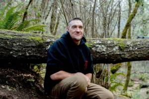 Scott Haury kneels along a pathway used for RC ‘crawling’ at the Black Diamond RC Ranch in Sutherlin, Oregon.