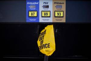 A gas pump is covered with a plastic bag during a fuel outage at a station in Smyrna, Ga., Monday, Sept. 19, 2016. Gas prices spiked and drivers found "out of service" bags covering pumps as the gas shortage in the South rolled into the work week, raising fears that the disruptions could become more widespread. Georgia Gov. Nathan Deal issued an executive order Monday aimed at preventing price gouging. (AP Photo/David Goldman)